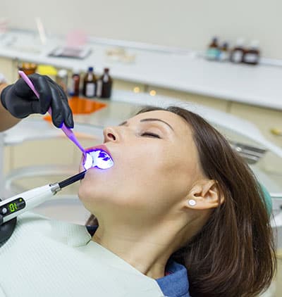 Sedated, relaxed patient receiving dental care