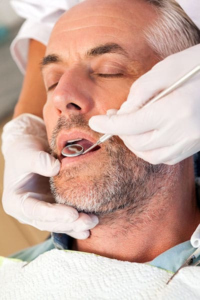 An unconscious dental patient