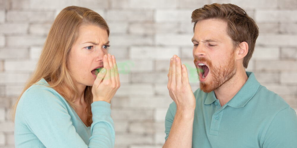 Couple checking bad breath